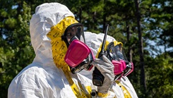 U.S. Air Force Airman 1st Class Raeven Anthony, 2nd Operational Medical Readiness Squadron bioenvironmental engineering technician, uses a walkie-talkie during a simulated nuclear response training
