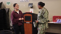 Capt. Janiese Cleckley (right), commanding officer of the Navy Medicine Readiness and Training Command Twentynine Palms and director of Naval Hospital Twentynine Palms, meets with staff and donors during a record-breaking blood drive