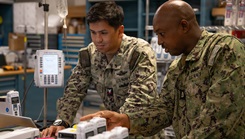 U.S. Navy Hospital Corpsman Chief Petty Officer Antares Zongo, material management equipment division leading chief petty officer at Naval Medical Center San Diego, provides instruction to Hospital Corpsman 2nd Class Arielle Sagum, biomedical equipment technician