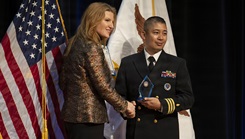 Cmdr. Raben B. Talvo accepting an award