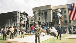 Col. Michael McCarthy, then a social work intern stationed at Andrews Air Force Base, Maryland, stands at the site of crash at the Pentagon