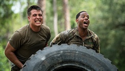 Airmen from the 822d Base Defense Squadron strain under the weight of a tire flip during the Scorpion Fire Team Challenge