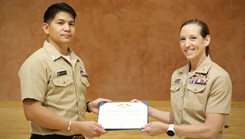 Hospital Corpsman 2nd Class Alvin Ciasico, with Naval Medical Research Command (NMRC), receives the Navy and Marine Corps Achievement Medal from Capt. Franca Jones, Commander, NMRC