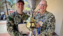 military medical personnel holding award