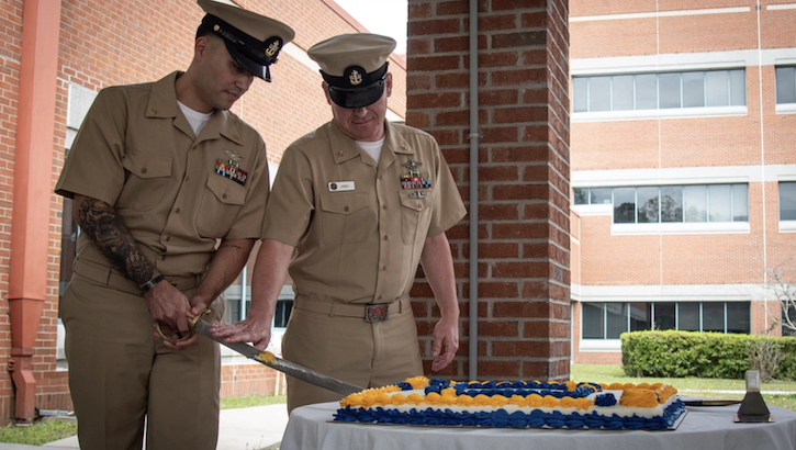 military personnel cutting cake at Cherry Point celebration