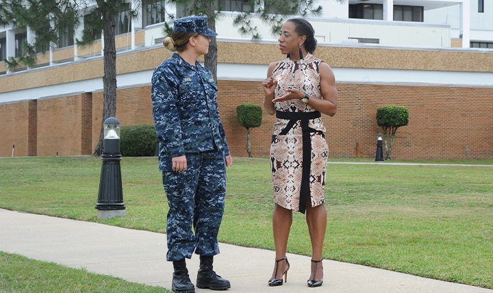 Laticia Jackson, a health educator, talks to a patient. Symptoms of communication disorders after a TBI can differ depending upon the type and severity of the injury. For many, problems with communication are the result of difficulties with attention and memory, such as not being able to follow a conversation, not with the ability to speak. (U.S. Navy photo by Jason Bortz)