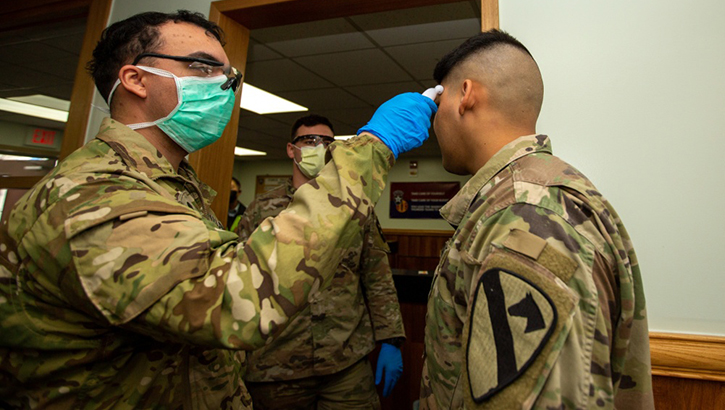 Soldiers stationed on U.S. Army Garrison Casey conduct pre-screening processes on individuals awaiting entry to the base, USAG-Casey, Dongducheon, Republic of Korea, Feb. 26, 2020. Additional screening measures of a verbal questionnaire and temperature check are in response to the heighted awareness of Coronavirus (COVID-19) following a surge in cases throughout the Republic of Korea and are meant to help control the spread of COVID-19 and to protect the force. (U.S. Army photo by Sgt. Amber I. Smith)