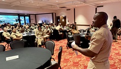 Cmdr. Temitope Ayeni, Naval Medical Center San Diego’s director for administration, addresses attendees during the 2025 Southern California MSC Symposium