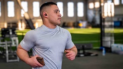 Senior Airman Zion Perrins running on a track