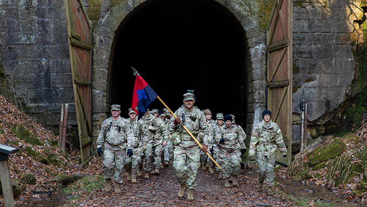 Image of Military personnel on a ruck march.
