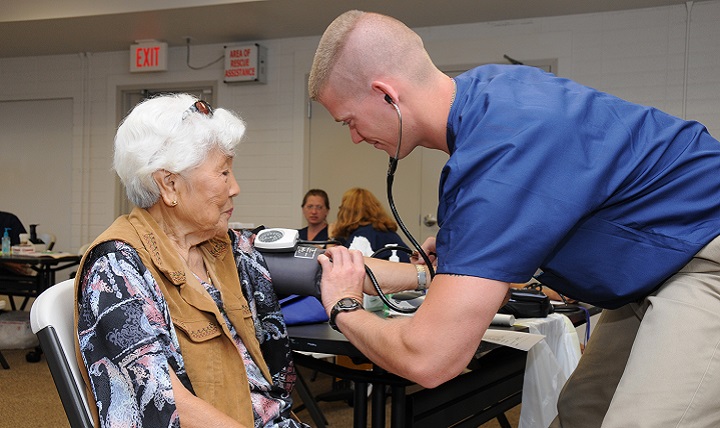 Air Force Staff Sgt. Nick Crouse, a medical technician with the 193rd Special Operations Wing's Medical Group out of Middletown, Pennsylvania, takes the blood pressure of a patient. Heart disease, diabetes, and chronic obstructive pulmonary disease are three ailments that take a huge toll on the body as it ages. (U.S. Air Force photo)