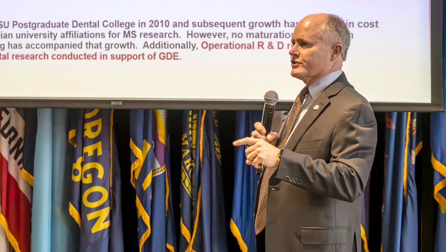 Dr. Drew Fallis, Executive Dean of the Postgraduate Dental College, addresses attendees