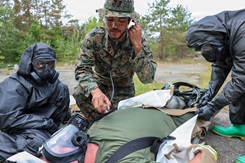 Corpsman checking vital signs