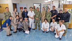 Mr. Katsuo Konno, a master labor contract employee and galley supervisor at U.S. Naval Hospital Yokosuka, stands with staff 
