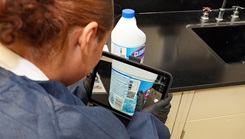 Hospital Corpsman 3rd Class Nimsi Hernandez, of Lancaster, Calif., assigned to Naval Medical Research Unit (NAMRU) San Antonio, utilizes a computer tablet to search for a Safety Data Sheet (SDS) at the Battlefield Health and Trauma Research Institute.