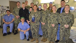 The Naval Hospital Bremerton Main Operating Room posing for a picture in the operating room