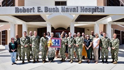 Staff and leadership from Naval Hospital Twentynine Palms gather in front of the hospital on August 20 with Commanding Officer Capt. Janiese Cleckley, Executive Officer Capt. Candace Foura, Command Master Chief HMCM Richard Moreno, Director for Public Health Cmdr. Christina Carter, and Public Health Specialist Tanya Stuckey 