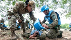U.S. Air Force Staff Sgt. Maritza Garcia, 154th Medical Group Detachment 1 medic and Tactical Combat Casualty Care instructor, evaluates Armed Forces of the Philippines students during a medical field training exercise