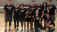 A group of Hematology Medical Oncology fellows and faculty are playing a game of volleyball. 
