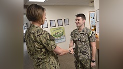 Capt. Karla Lepore, Navy Medicine Readiness Training Command Bremerton commanding officer congratulates Hospital Corpsman 2nd Class Cade Crenshaw
