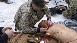 Hospital Corpsman 2nd Class Richard Blair, assigned to the Naval Postgraduate Dental School at the Naval Medical Leader and Professional Development Command, simulated administering a shot during a final exercise