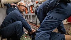 Hospital Corpsman 3rd Class Steward Cotui Mercedes checks vitals on a mock casualty