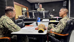 U.S. Navy Chaplain Lt. Cmdr. Brady Rentz, assigned to Navy Medicine Readiness and Training Command (NMRTC) Rota, engages with a Sailor at U.S. Naval Hospital Rota. Rentz provides spiritual guidance and promotes resilience in support of total force readiness
