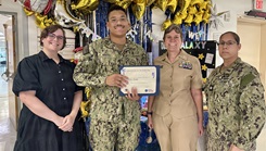 Information Systems Technician Seaman Aaron Mendez receives a Reliability in Action Certificate of Recognition at U.S. Naval Hospital Guantanamo Bay