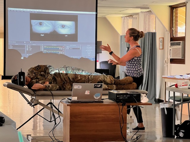 Image of Karen Lambert, Hearing Center of Excellence, uses a model of the vestibular system to reinforce the anatomy of the inner ear during a lecture on positional testing for benign paroxysmal positional vertigo (BPPV), a common cause of dizziness and imbalance, during a December 2022 Military Vestibular Assessment and Rehabilitation training at the U.S. Army’s Schofield Barracks, Hawaii. MVAR training helps physical therapists better deal with patients with mild concussion and is available through HCE. (U.S. Army Maj. Mark Mateja).