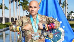 Air Force Col. Alfredo "Juny" Laboy poses with his World Marathon Majors medals outside U.S. Southern Command headquarters