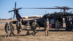 Third-year military medical students evacuate a simulated patient during a prolonged casualty care scenario 