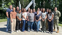 Kimberly Bishop-Lilly (first row, third from left) poses for a photo with members of Naval Medical Research Command’s (NMRC) Genomics & Bioinformatics Department. 