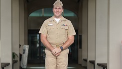 Lt. Jacob King, a pharmacist at U.S. Naval Hospital Guam, poses for a photo in front of the hospital