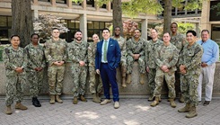 Army Lt. Col. Jesse Tafoya, pictured center, stands with members of the MHAP cohort on the last day of Spring Term 2025