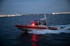 Photo by Petty Officer 2nd Class Matthew Thieme, U.S. Coast Guard East: A U.S. Coast Guard 29-foot Response Boat-Small from Coast Guard Station Portsmouth transits near the Port of Virginia. This work must comply with the restrictions shown on https://www.dvidshub.net/about/copyright