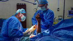 Major Daniel Thompson performing a surgery