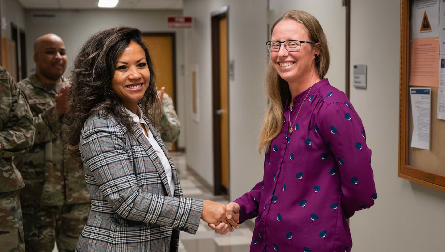 Mei-Ling C. Taylor, deputy director and chief of staff for Defense Health Network Central, listens to members of the Altus military medical treatment facility resource management office 
