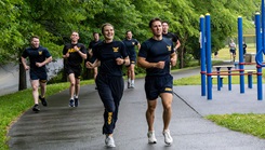 Uniformed Services University students and staff run along a paved path