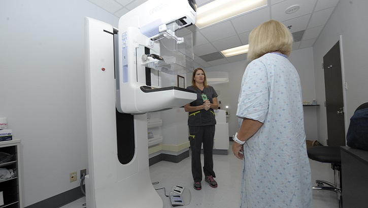 Jennifer Oubre, a certified mammogram technician at Naval Health Clinic Corpus Christi in Texas, validates a patient’s identity to prevent wrong-patient error prior to administering a mammogram. (U.S. Navy photo by Bill W. Love)