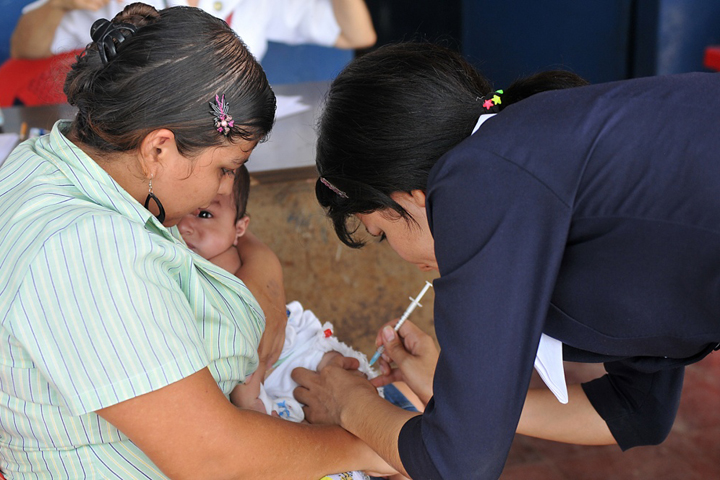A Salvadoran nurse vaccinates a baby during a Task Force Northstar mission in El Salvador to provide medical care and other humanitarian and civic assistance. The mission involved U.S. military personnel working alongside their Brazilian, Canadian, Chilean, and Salvadoran counterparts. (U.S. Army Photo by Sgt. Kim Browne)
