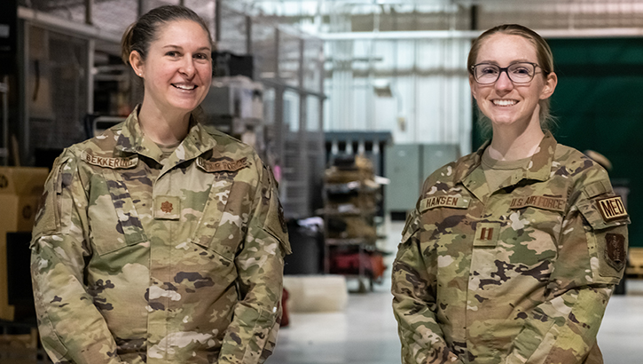 U.S. Air Force Maj. Jessica Bekkering and U.S. Air Force Capt. Brooke Hansen, both clinical nurses assigned to the medical element of Indiana’s 19th Chemical, Biological, Radiological, Nuclear, and high-yield Explosives Enhanced Response Force Package, pose for a photo at Hulman Field Air National Guard Base, Indiana.  (Photo by U.S. Air National Guard Master Sgt. L. Roland Sturm) 