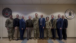 From left to right, U.S. Air Force Col. Christopher Vojta, Uniformed Services University of the Health Sciences radiology department, U.S. Navy Cmdr. John Dryden, USUHS radiology department, Richard Breen, Military Health System Communications director, U.S. Army Col. Robert Heath, Assistant Secretary of War for Health Affairs military deputy, U.S. Air Force Col. Andrew Rohrer, Armed Forces Medical Examiner System director, Dr. Stephen Ferrara, Acting Assistant Secretary of War for Health Affairs, U.S. Air Force Maj. Gen. Jeannine Ryder, Acting Assistant Director of Healthcare Administration for the Defense Health Agency, Dr. Eric Elster, USUHS School of Medicine dean, Dr. Andrew Sims, AFMES chief of staff, Dr. Vincent Ho, USUHS radiology department, pose for a photo