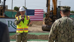 Rear Adm. Robert Hawkins, director of Defense Health Network Atlantic and commander of Naval Medical Forces Atlantic, addresses installation leadership, contracting representatives, and project stakeholders during a groundbreaking ceremony for the construction of the new ambulatory care center aboard Naval Station Guantanamo Bay