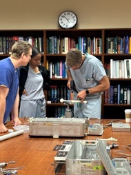 NMCSD Orthopaedic Surgery residents work with a vendor to familiarize themselves with new equipment.