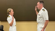 CDR Lisa Mondzelewski (Pediatric Residency Program Director) promotes a NMCSD Pediatrics resident from LT to LCDR.