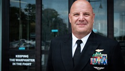 Navy Cmdr. Carlton Bennett III posing for a picture