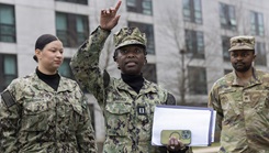 Navy Lt. Abena Nimako, Walter Reed National Military Medical Center medevac department officer in charge, briefs the medevac team prior to a mission at the medical center