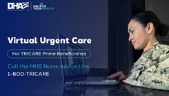 Military personnel typing on a laptop