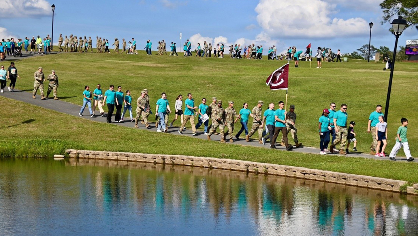 Participants walk along the path during the Walk to Empower event