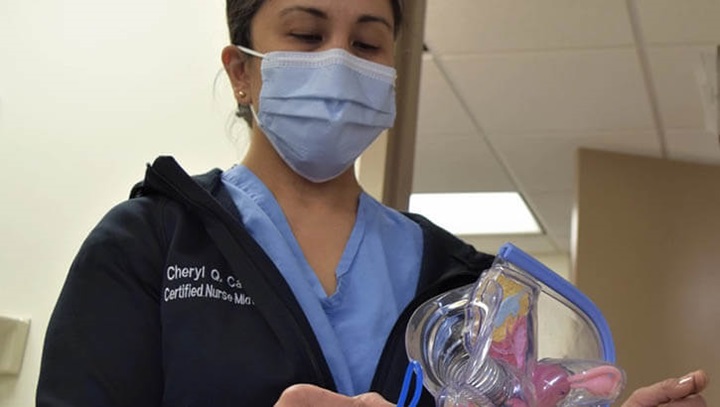 Image of Bremerton nurse midwife demonstrates vaginal ring placement.